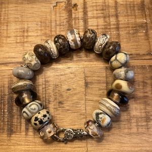 Trollbeads bracelet and lock. 4 Trollbeads and 17 Artisan beads.
